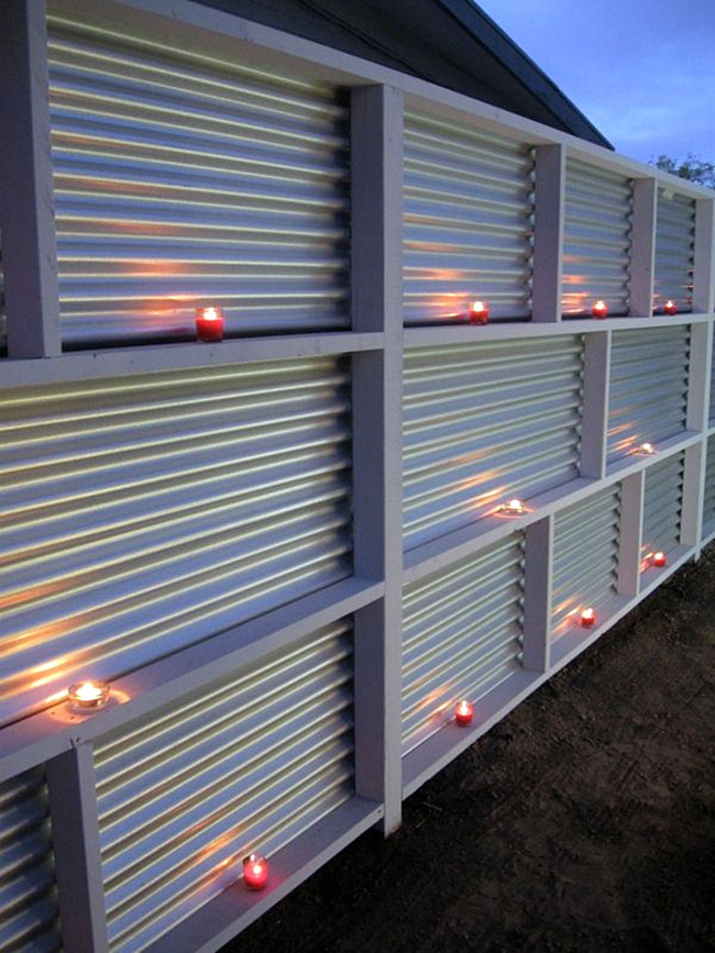 Corrugated metal fence with candles