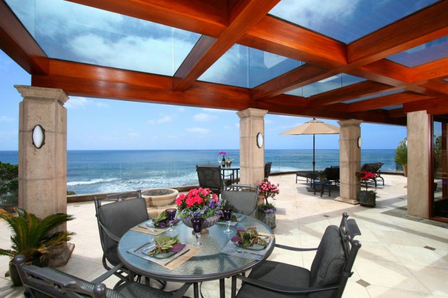 Covered patio with a glass sun awning