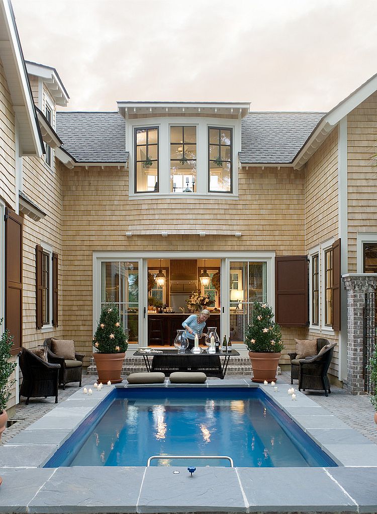 Modern small pool that is in the courtyard of a house.