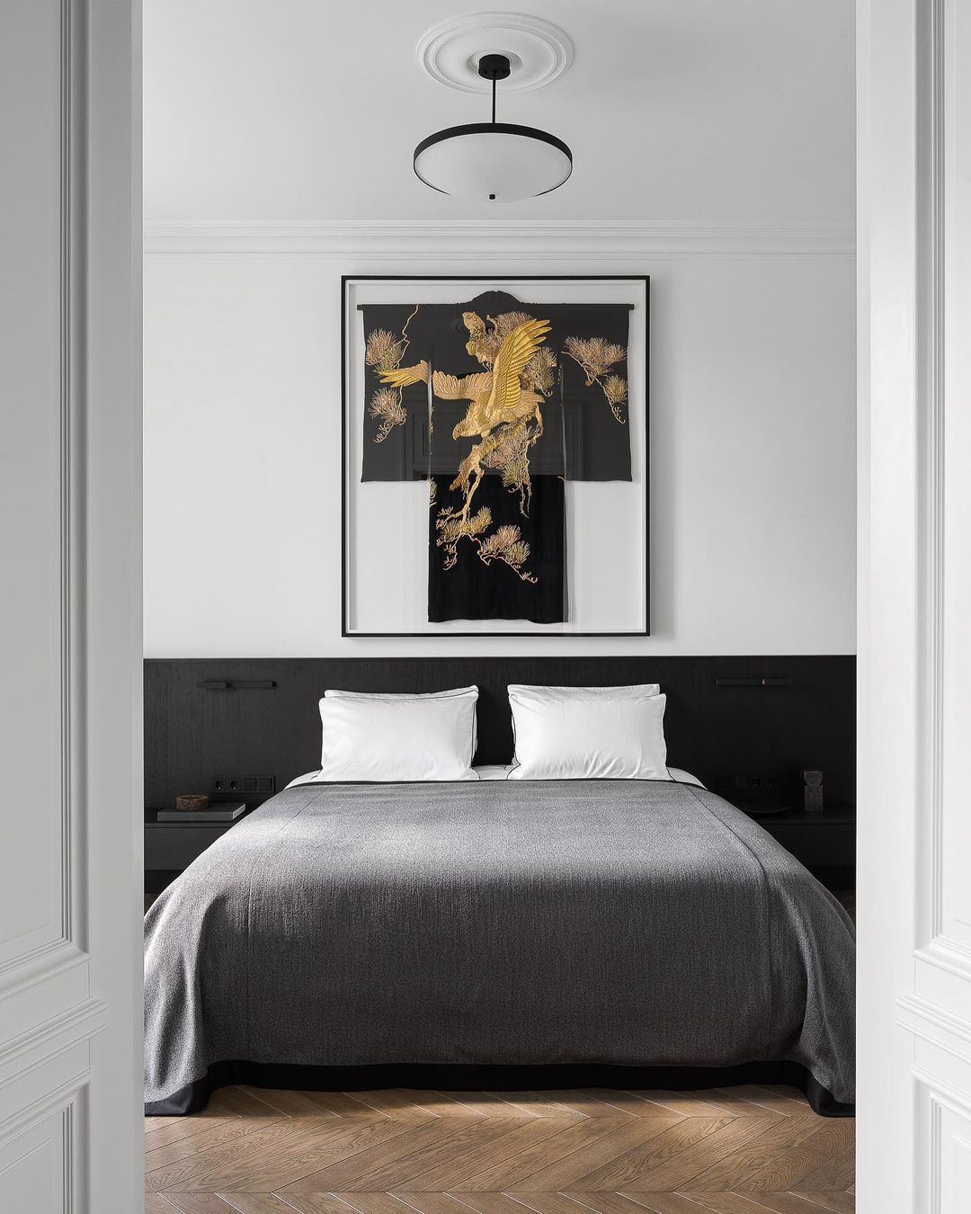 A Bedroom in Black and White with Grey Bedding