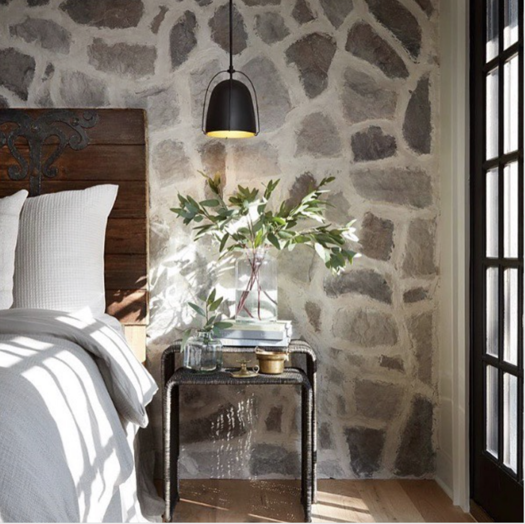 A Bedroom with Rustic Style and Stone Walls