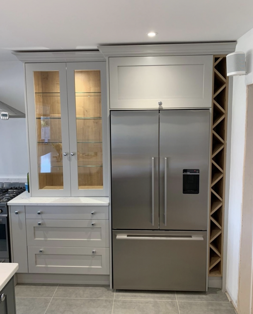 A Cabinet in Light Grey Above the Refrigerator