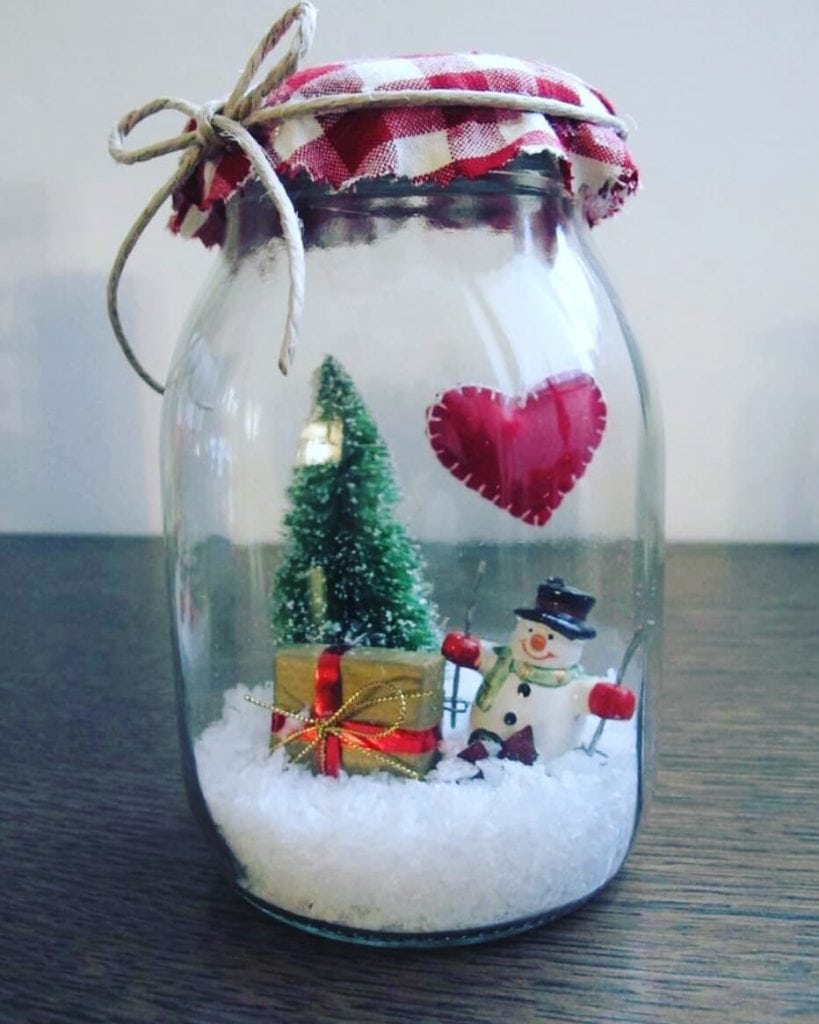 A Jar with a Christmas Landscape