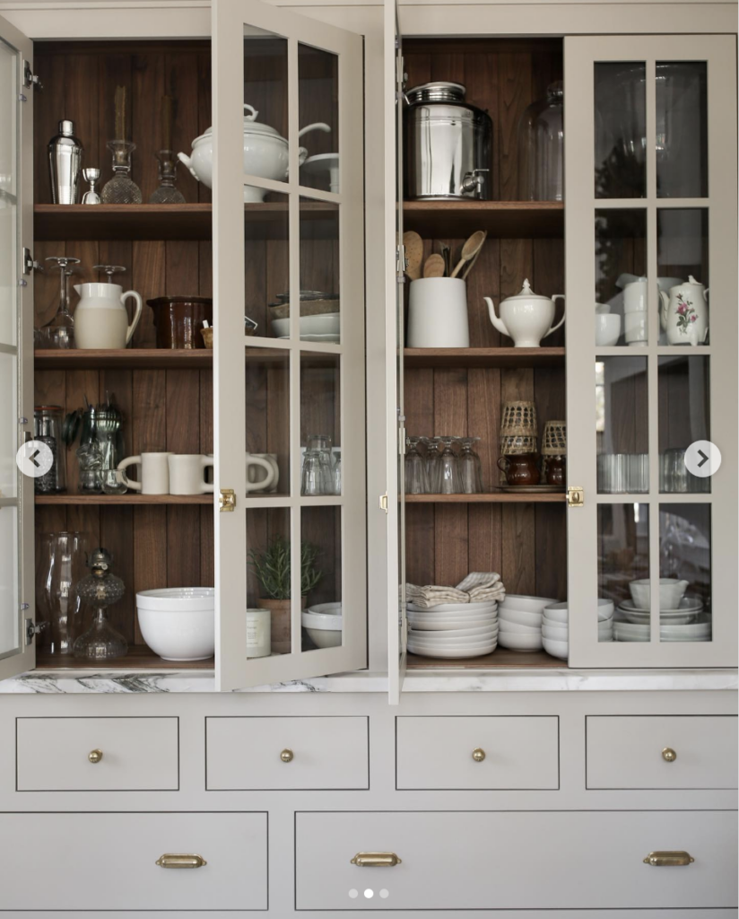 A Kitchen of Light Grey Cabinets and Gold Hardware