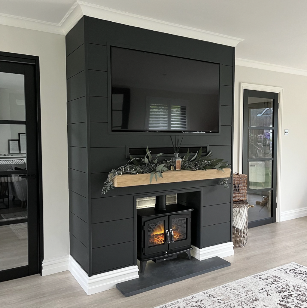 A Modern Fireplace in Black Shiplap with a Shiplap Accent Wall