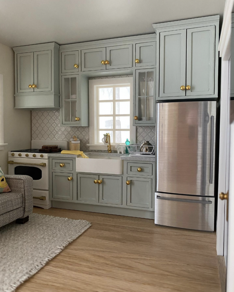 A Sage Green Cabinet Above the Refrigerator in a Small Size