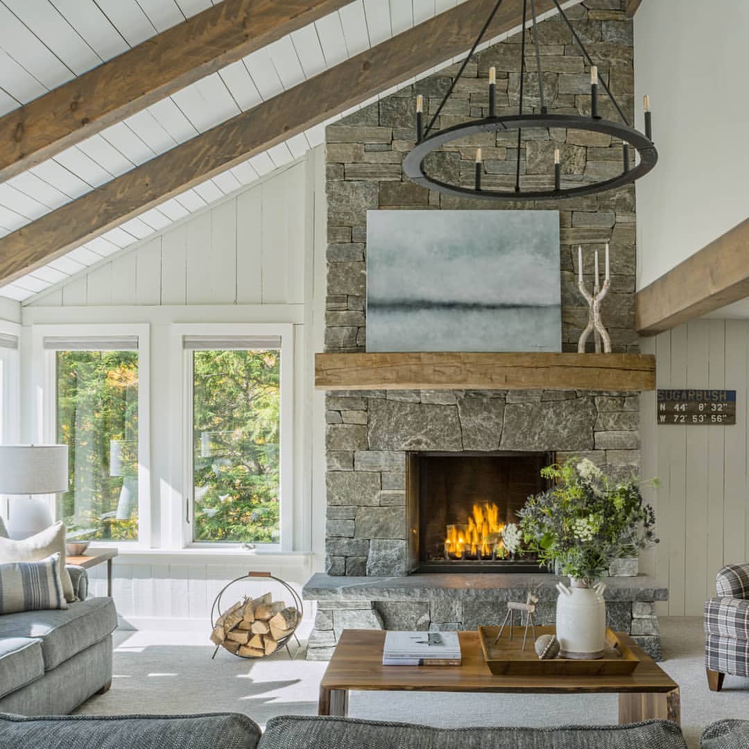Angled Wood Beams With a Stone Fireplace