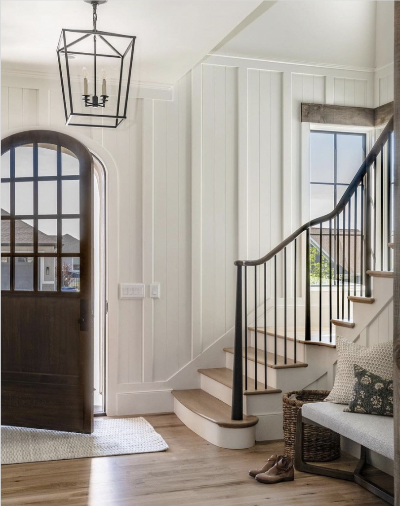 Wooden Arched Door With Entryway Chandelier