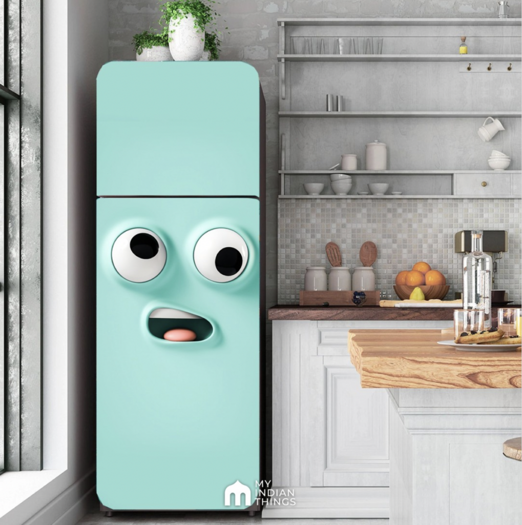 Assorted Green Planters Above a Blue Fridge