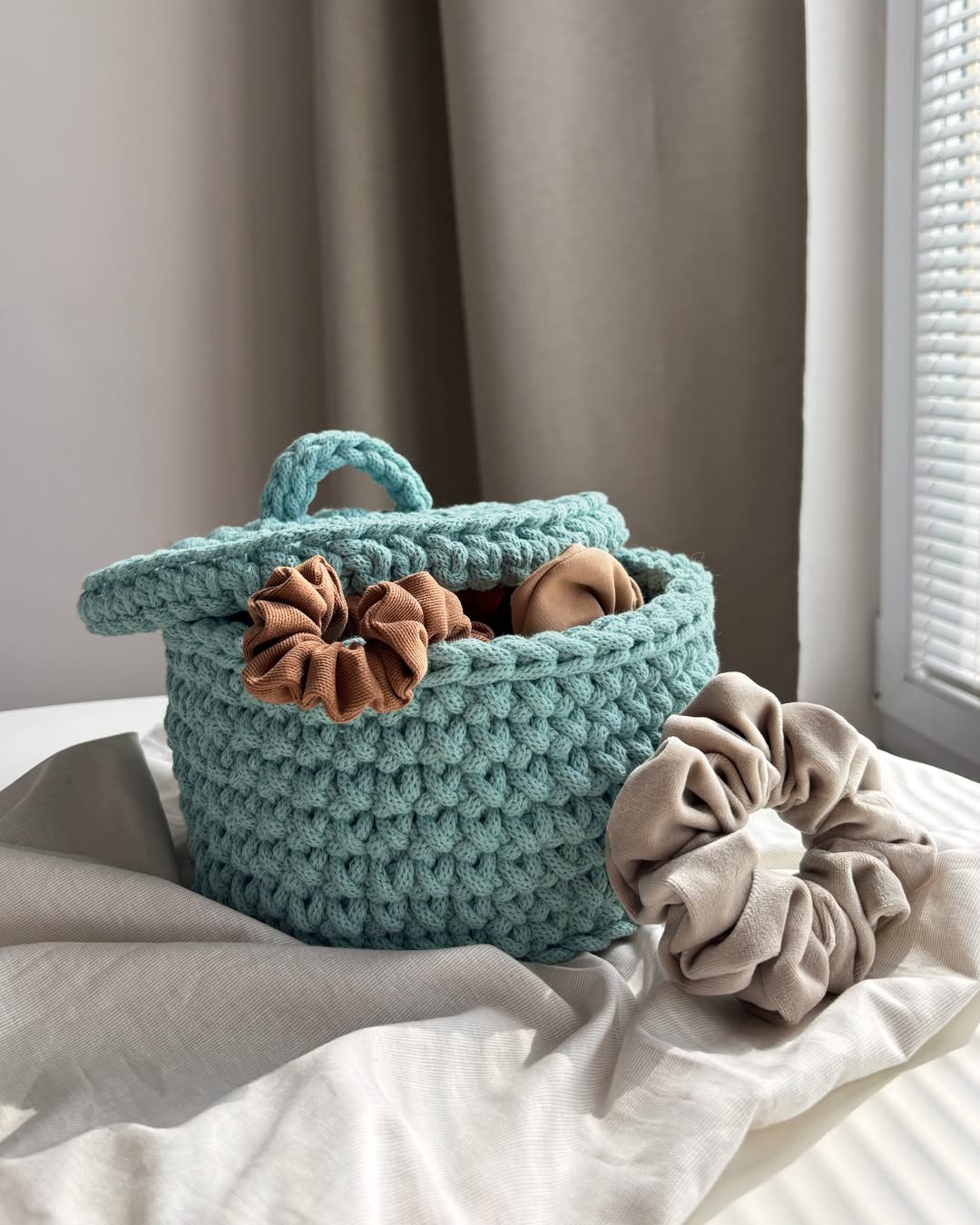 Basket with a lid for soft essentials