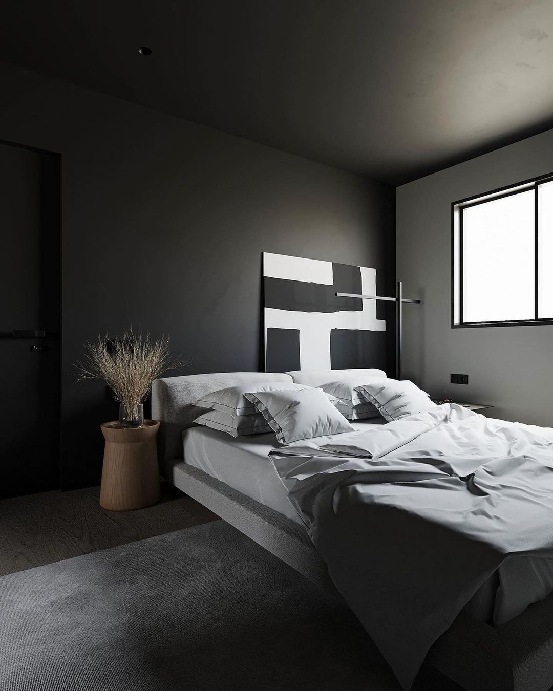 Bedroom with a grey, black and white look and a window
