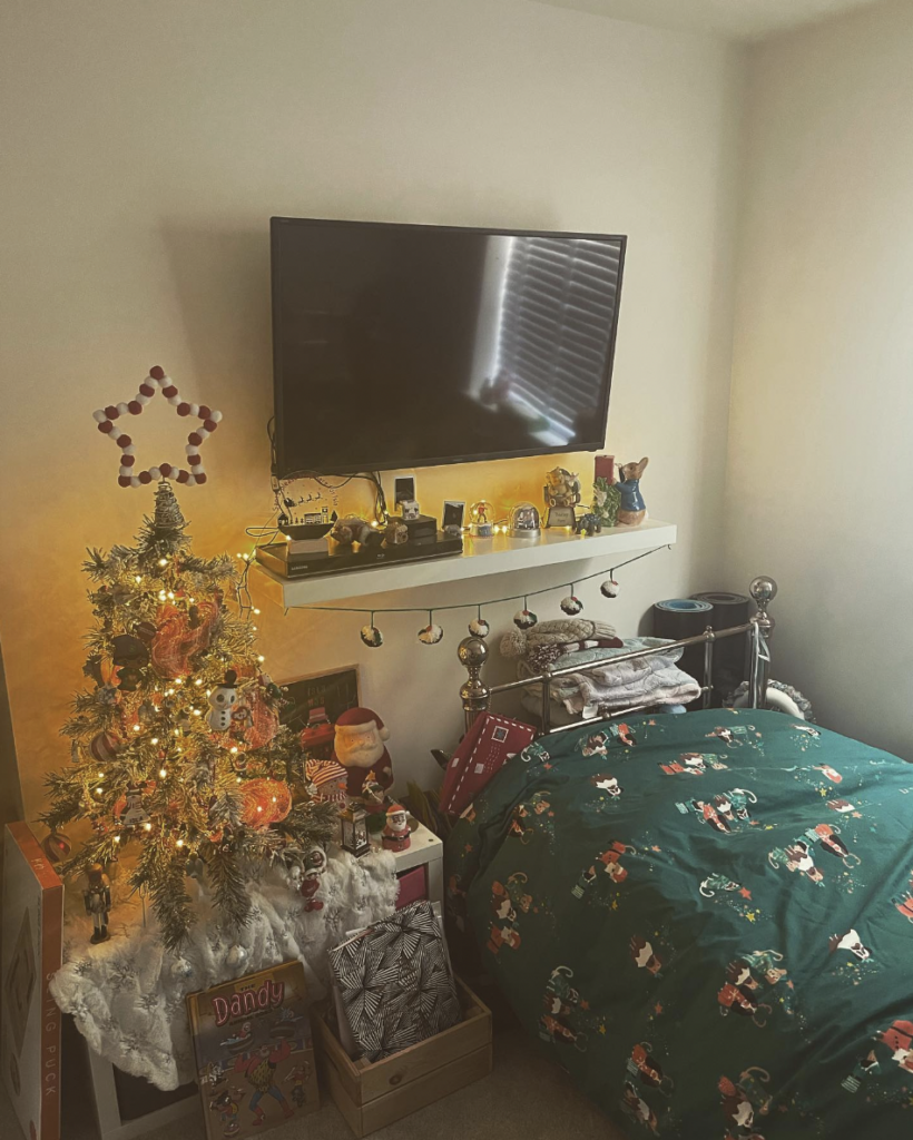 Bedroom with a TV and Christmas Decor