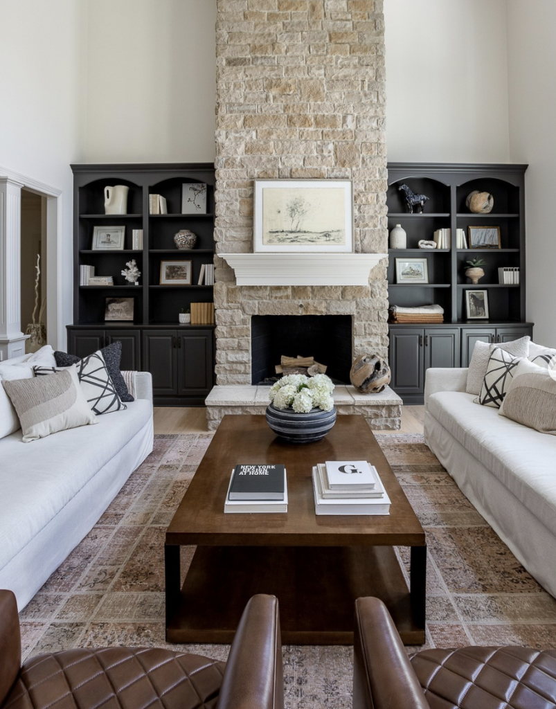 Beige Stone Fireplace with Black Cabinets