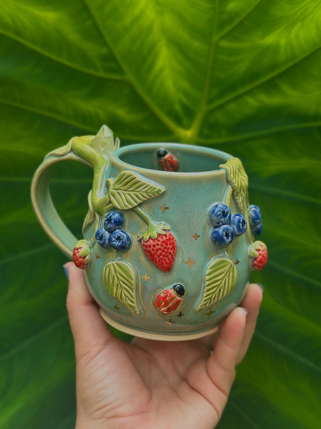 Berry-Themed Mug with Soft Green Glaze