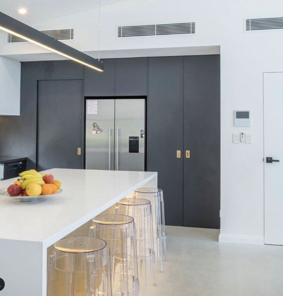 Black Above-Fridge Cabinet with Gold Metal Hardware