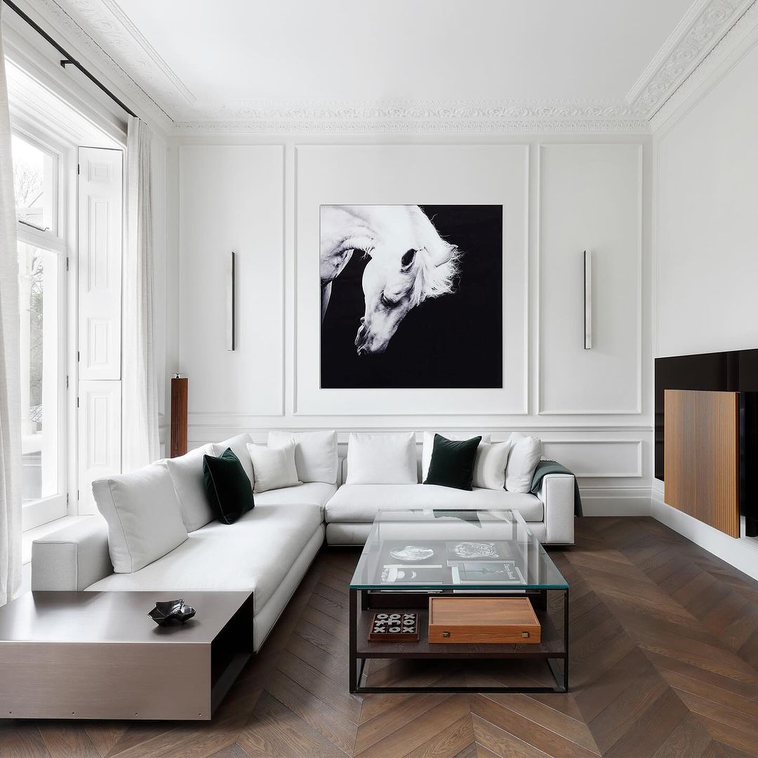 Black Artwork with a White Sofa and Herringbone Floor