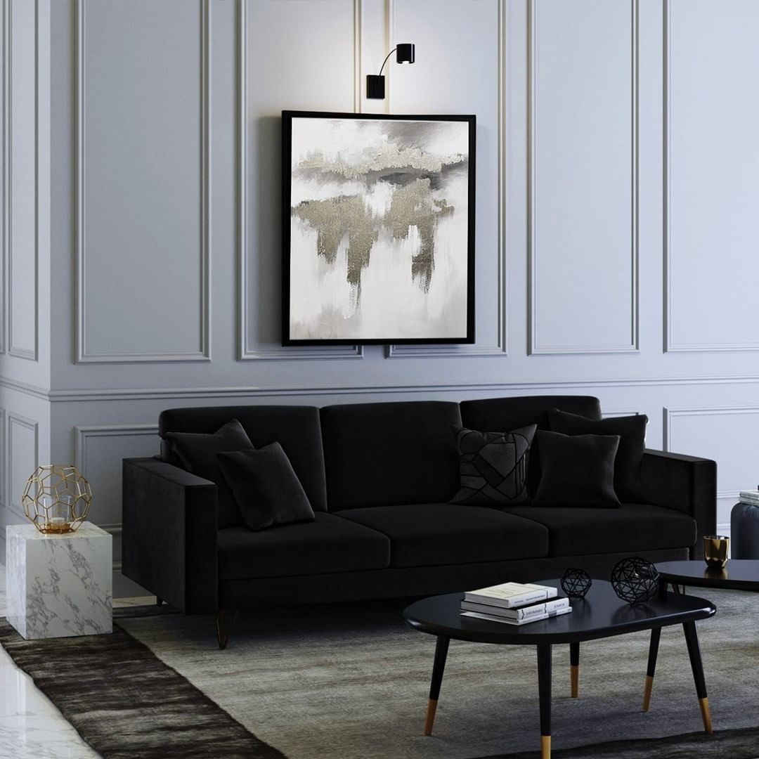 Black Couch Against Classic Paneled Walls