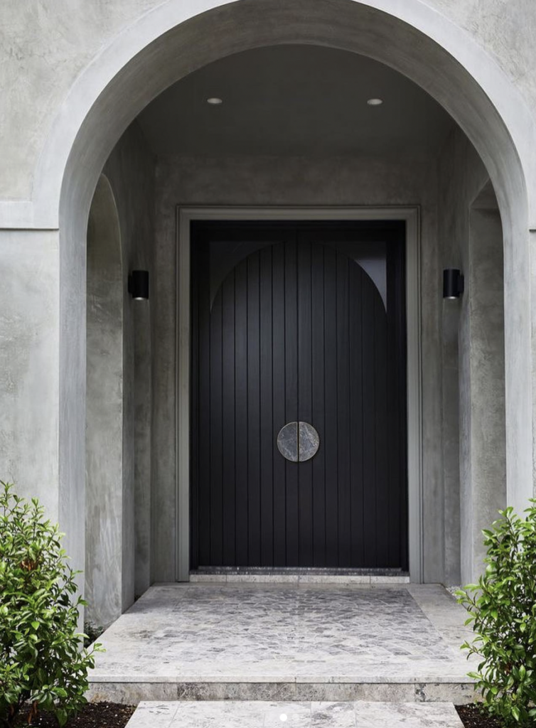 Black Doors on Concrete Houses