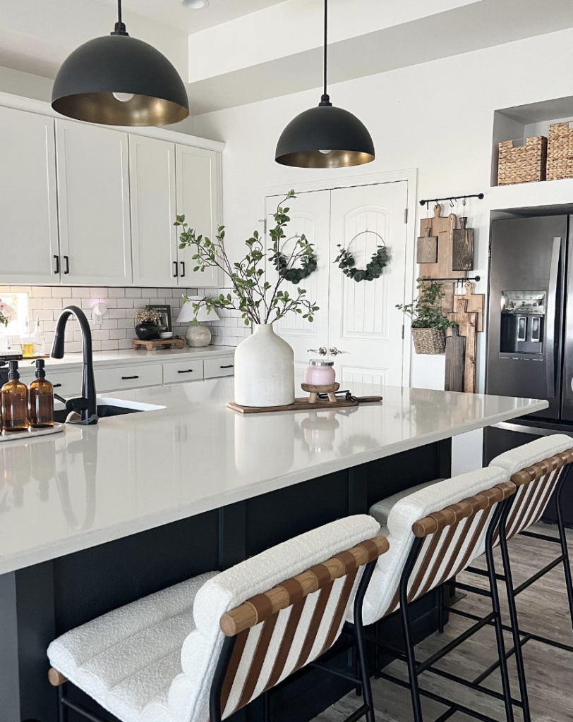 Black Fixtures Hanging Above the Kitchen Sink