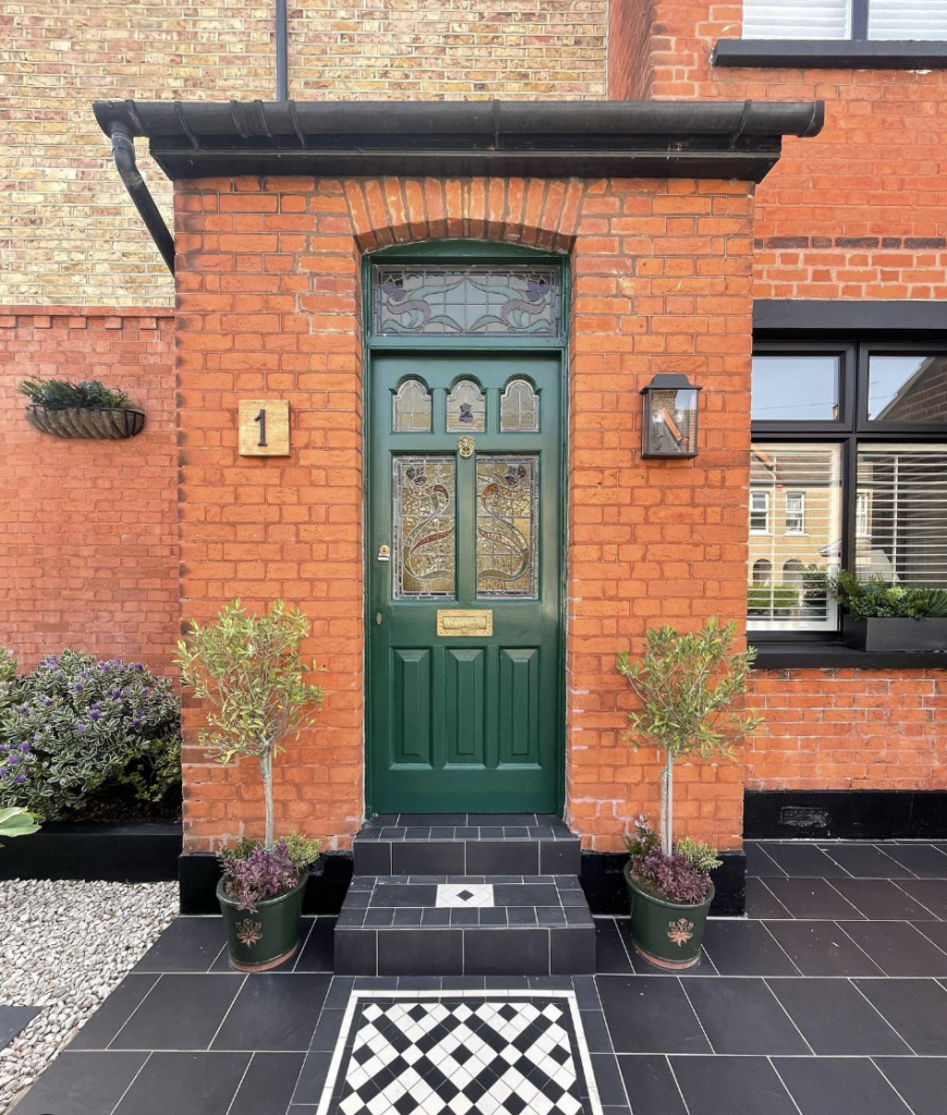 Black Flooring with an Olive Green Door