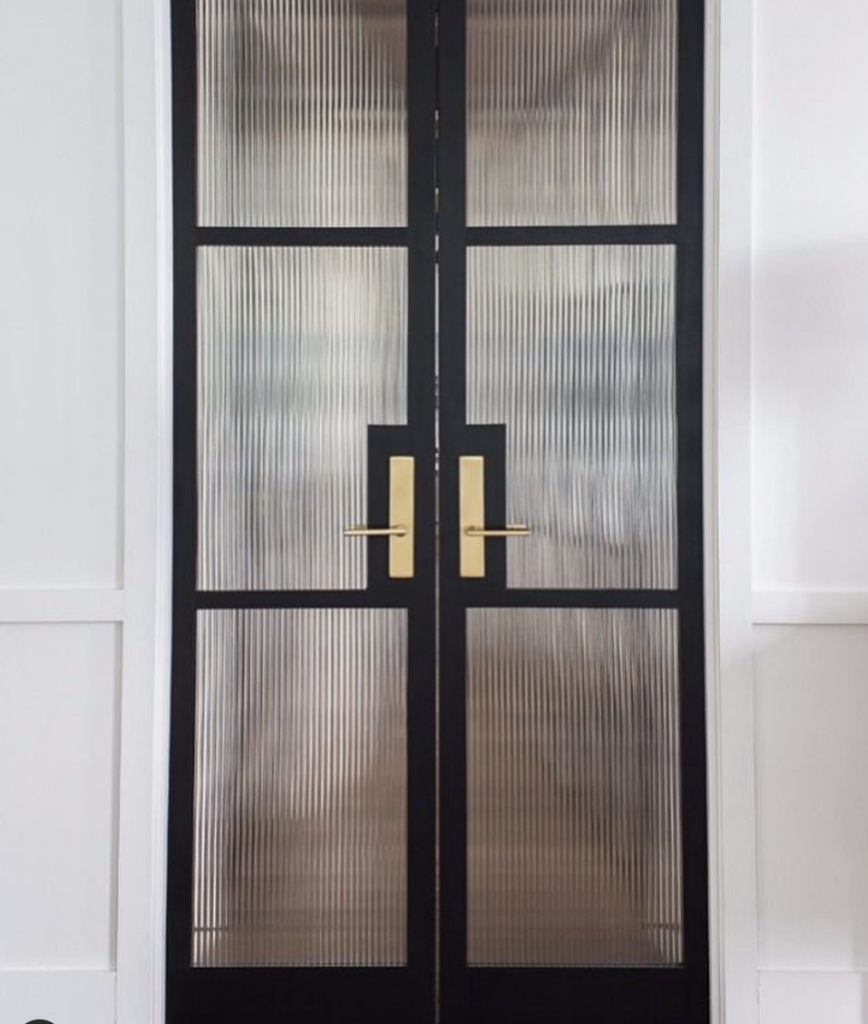 Black Glass Panel Door with Gold Hardware