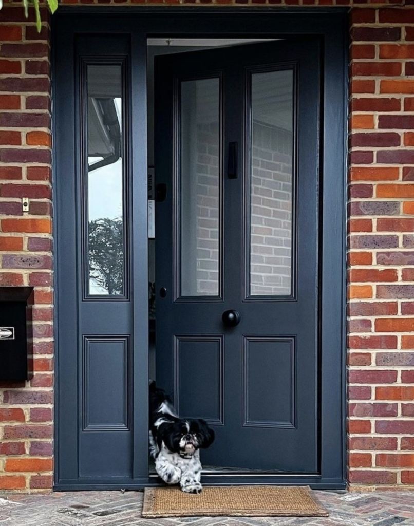 Black or Blue Door on a Brick House