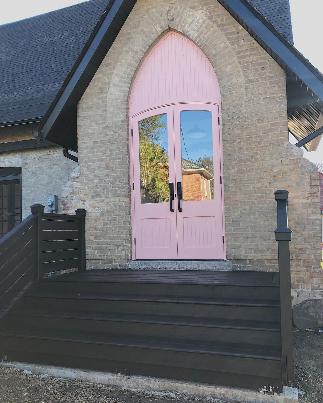 Black Painted Wood Steps with a Pink Front Door