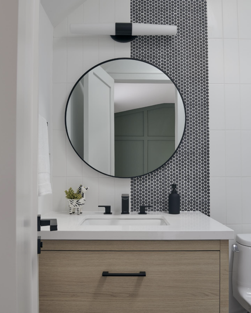 Black Penny Round Mosaic Tile Paired With White Vertical Walls