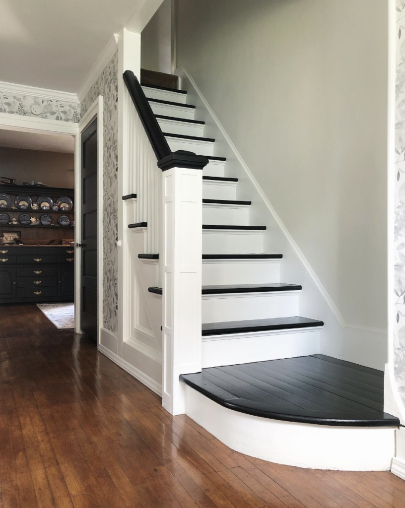 Black Steps with Intricate Floral Walls