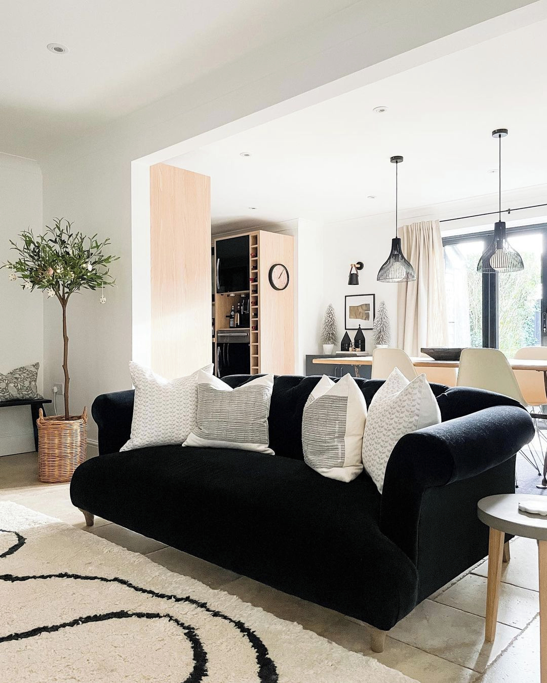 Black Couch with Light Wood and Clean Lines