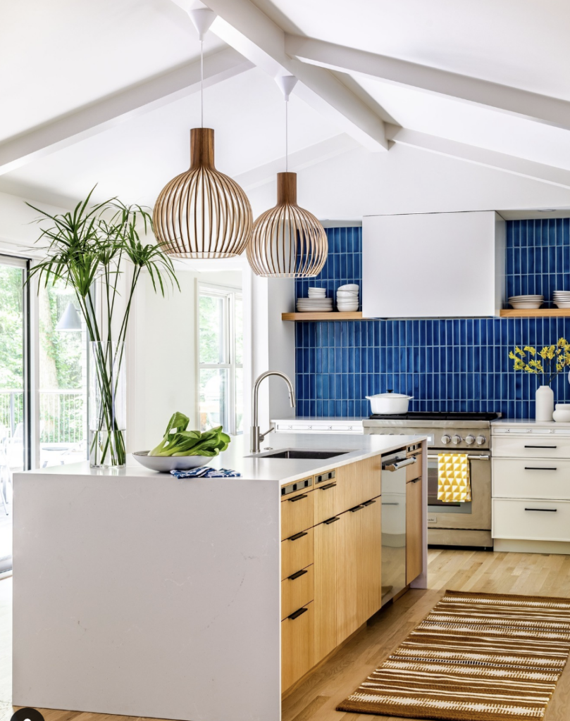 Blue Backsplash Paired with a Brass Pendant Light