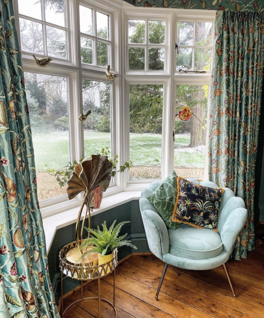 Blue Nature-Inspired Curtains for a White Shutter Window