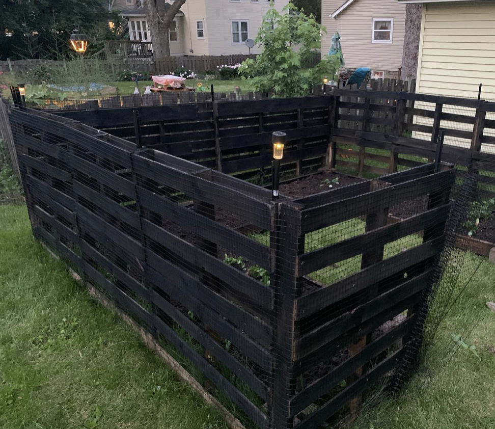 Bold Edgy Painted Black Pallet Fence