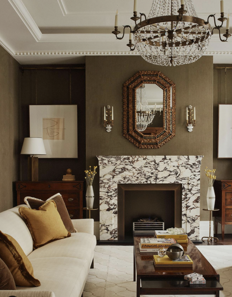 Brown Room Featuring a Fireplace and Mirror