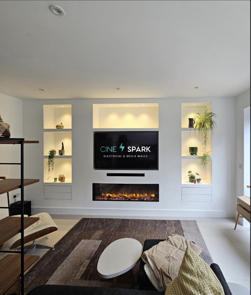 Built-in recessed electric fireplace with TV above in living room