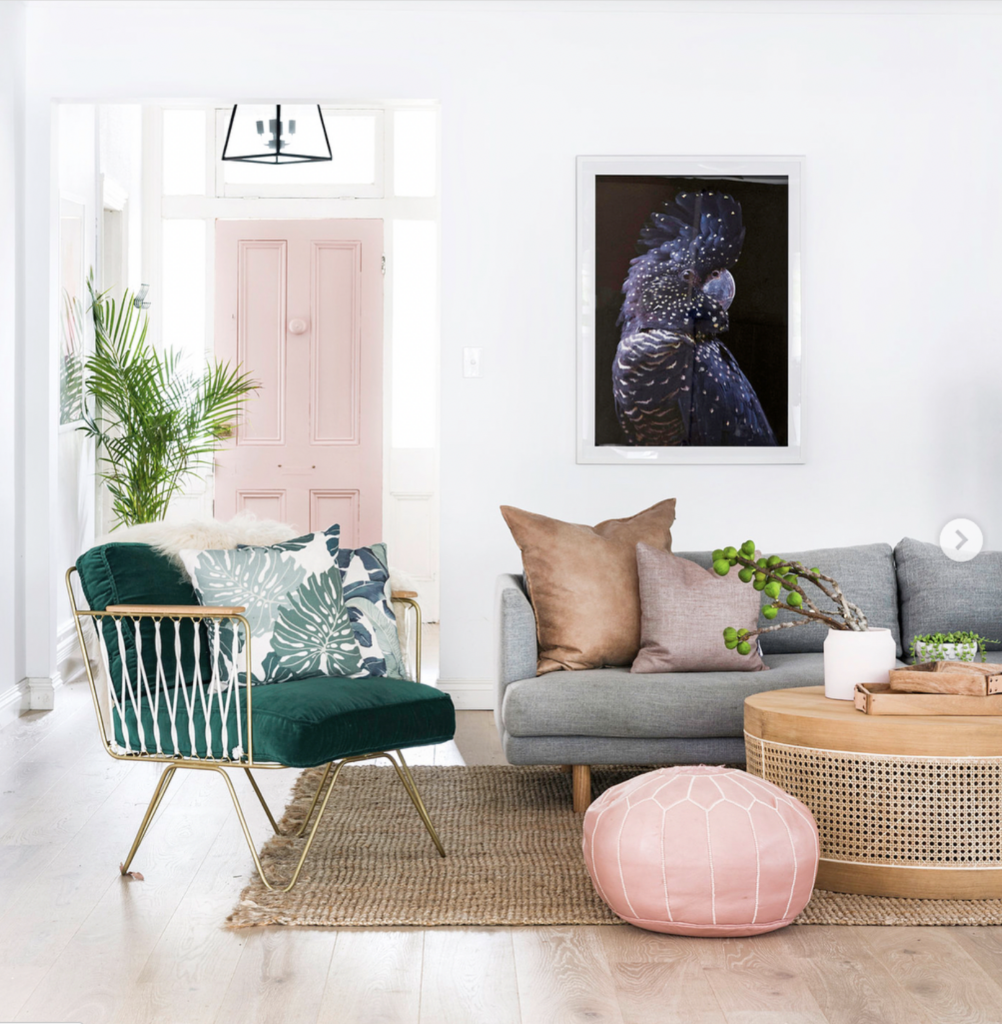 Colorful Living Room Beyond a Pink Door