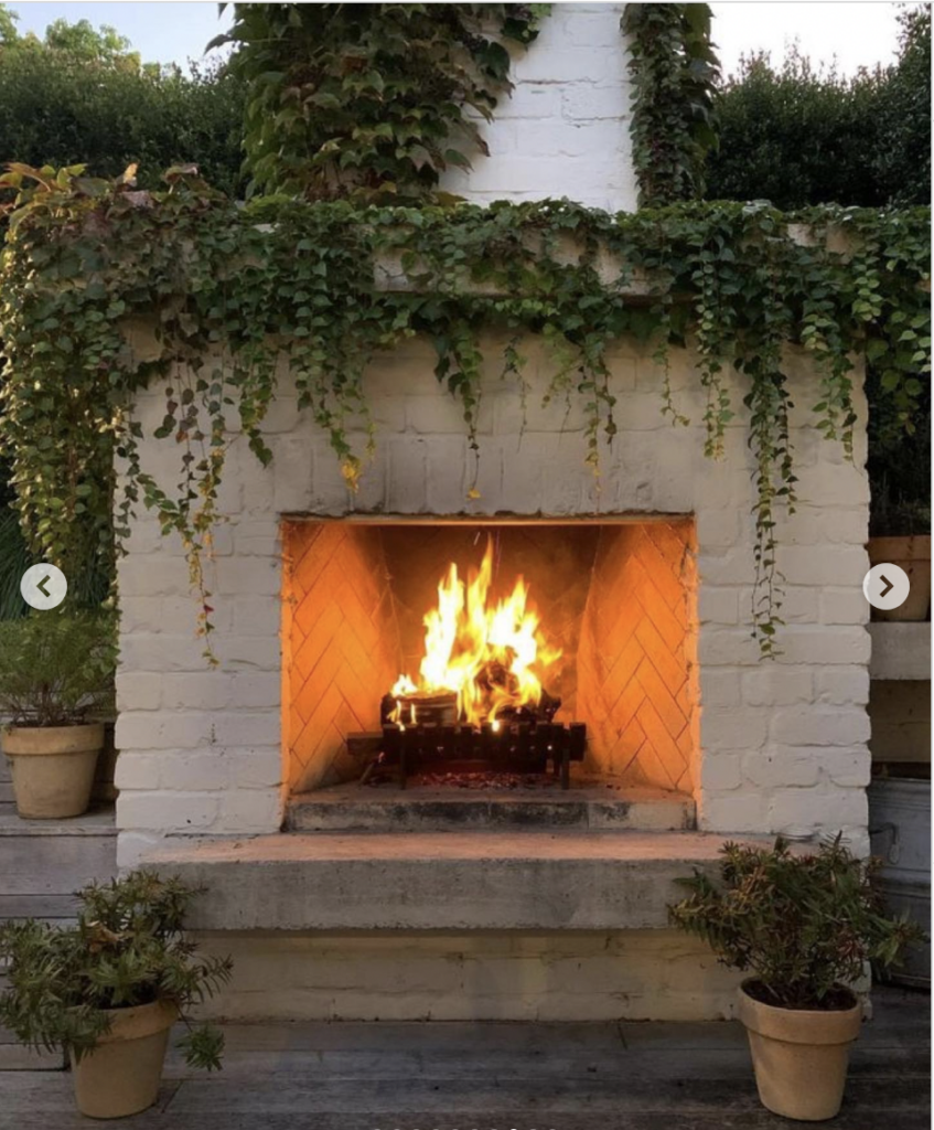 Concrete hearth for a white brick fireplace outside