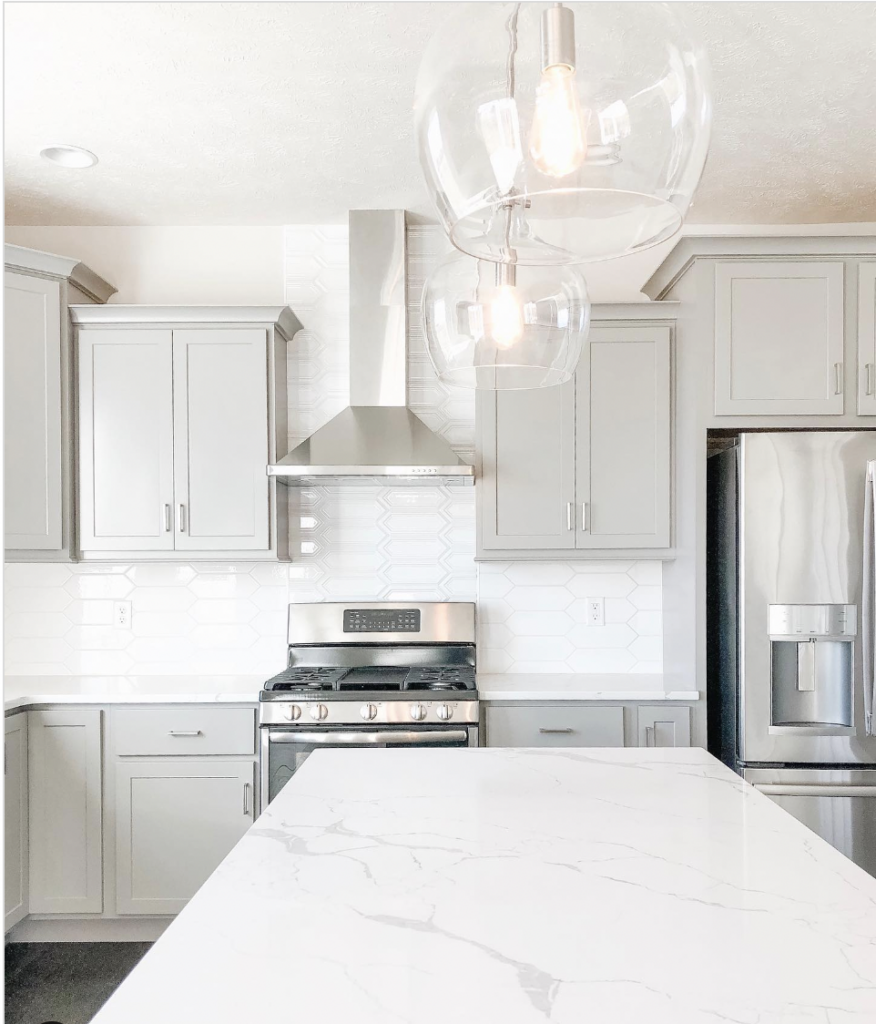 Contemporary Grey Cabinets with Marble Island Countertop