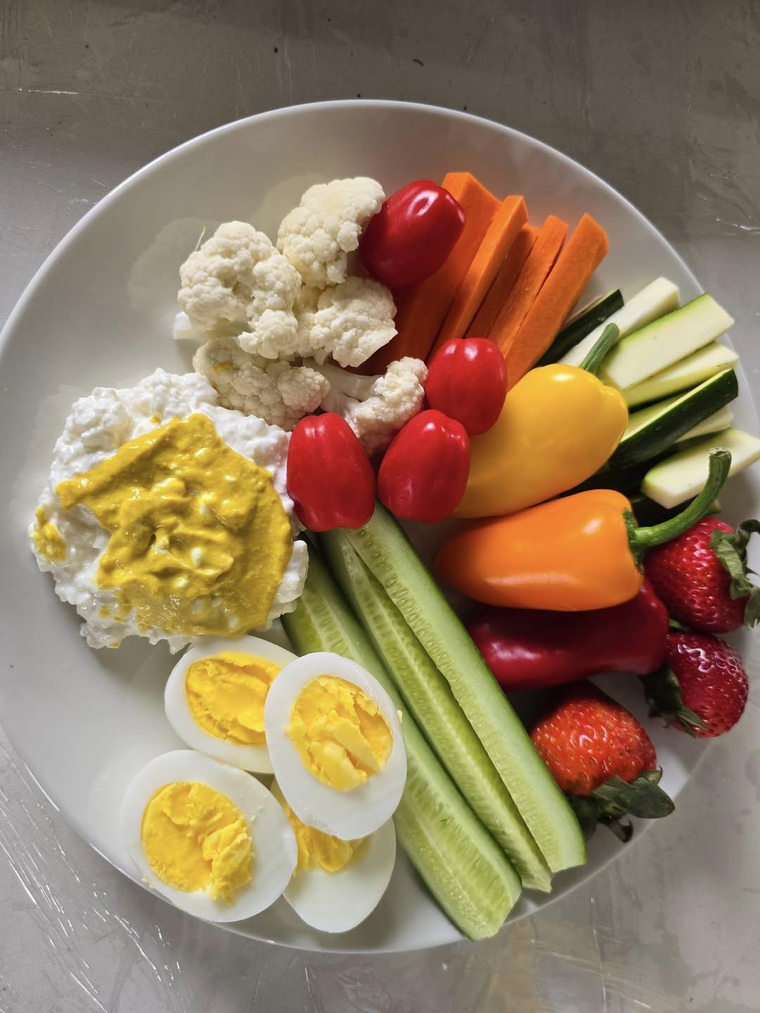 Classic Tiffany Plate with boiled eggs, zucchini matchsticks, cauliflower, mini peppers, and strawberries