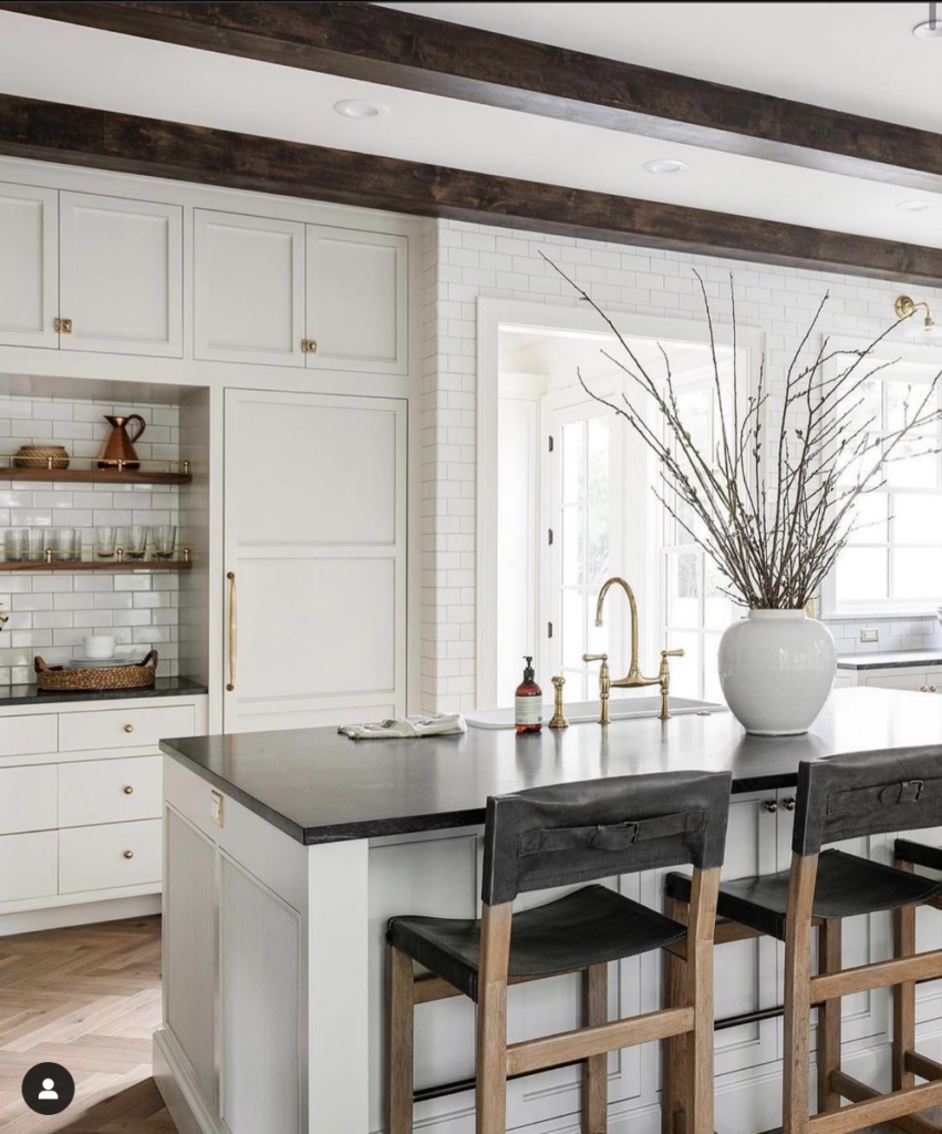 Dark Cabinets with White Countertops and Subway Tile Backsplash