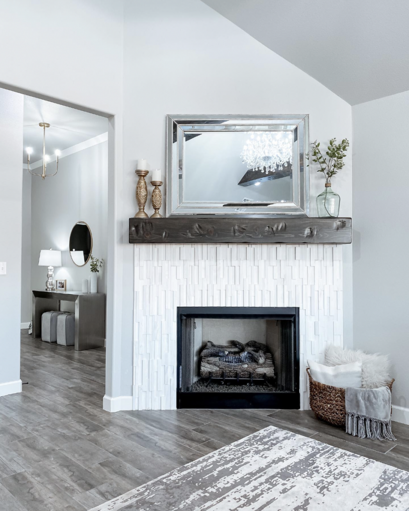 Dark Wood Flooring Paired with White Tile Fireplace