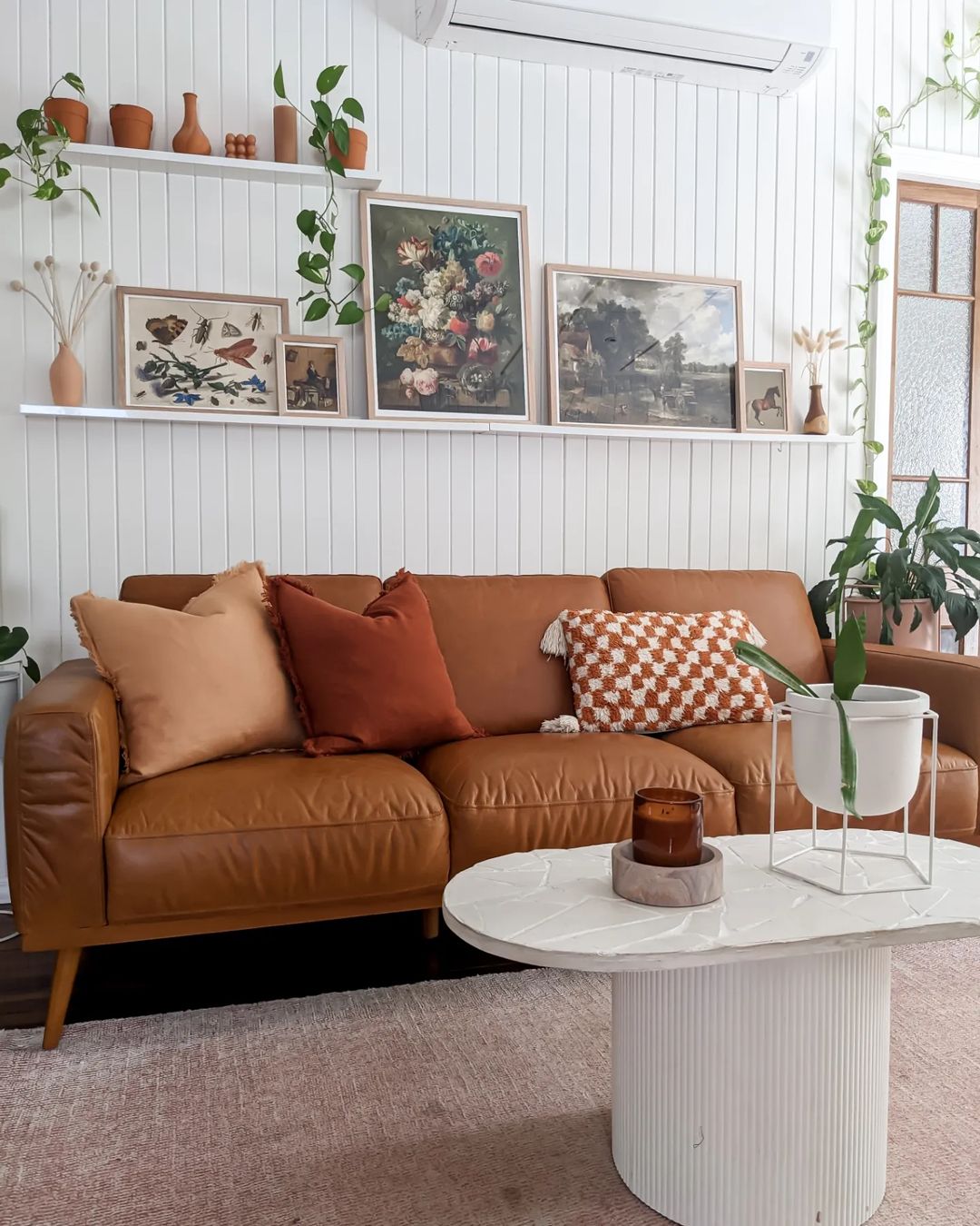 Eclectic Living Room with Art-Filled Picture Ledge Display