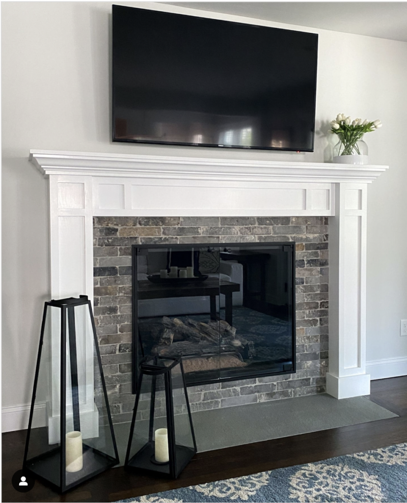 Exposed Brick Fireplace and Grey Carpet Hearth