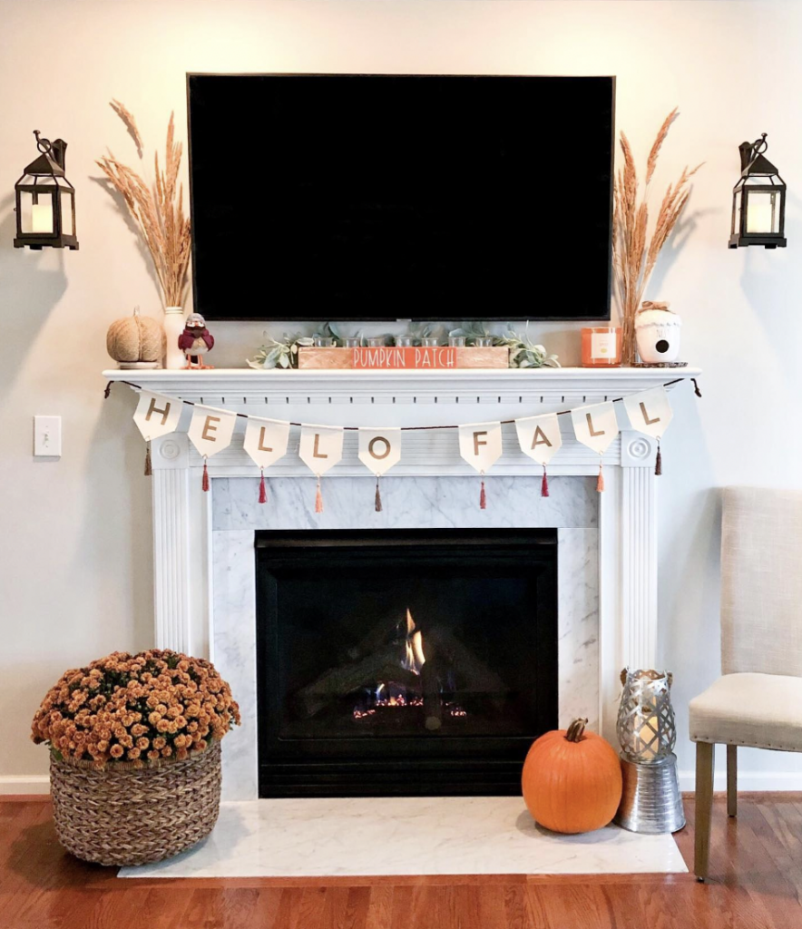 Fall Fireplace and Sconce Beside the TV