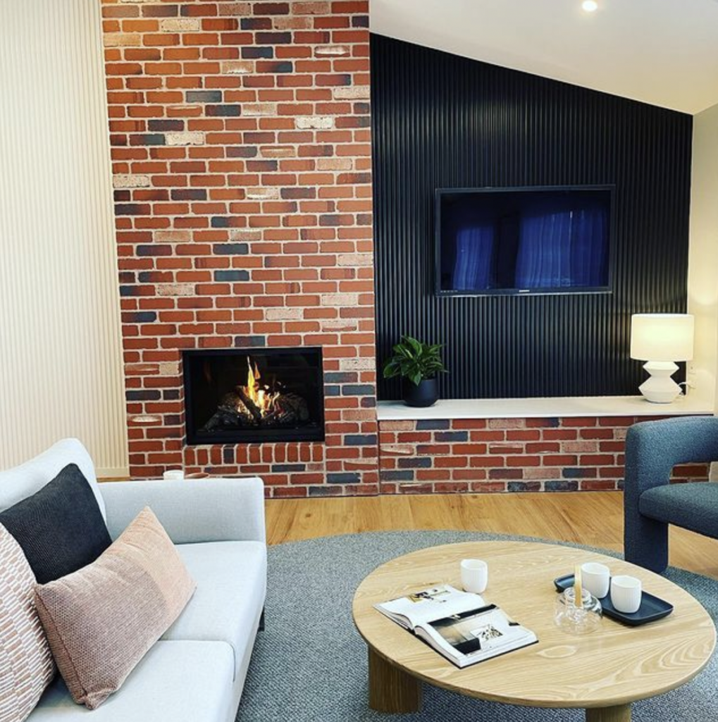 Fireplace Beside a Black TV Wall