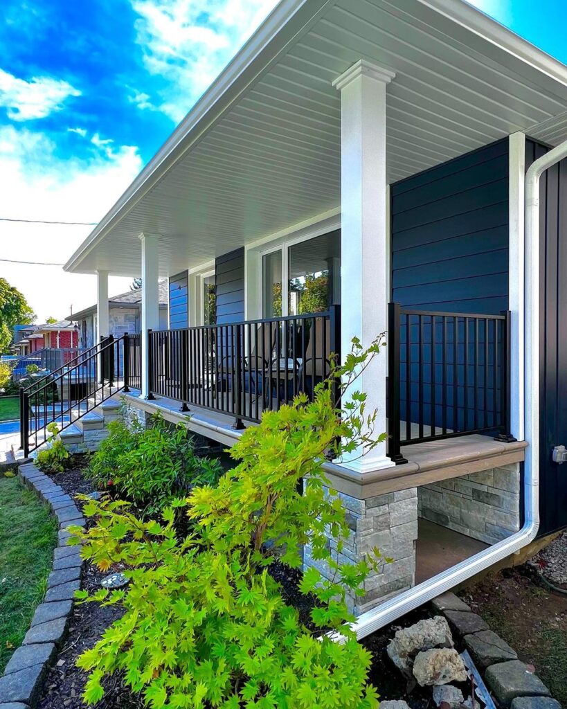 Front Porch with Black Railing and Dark Grey Shiplap