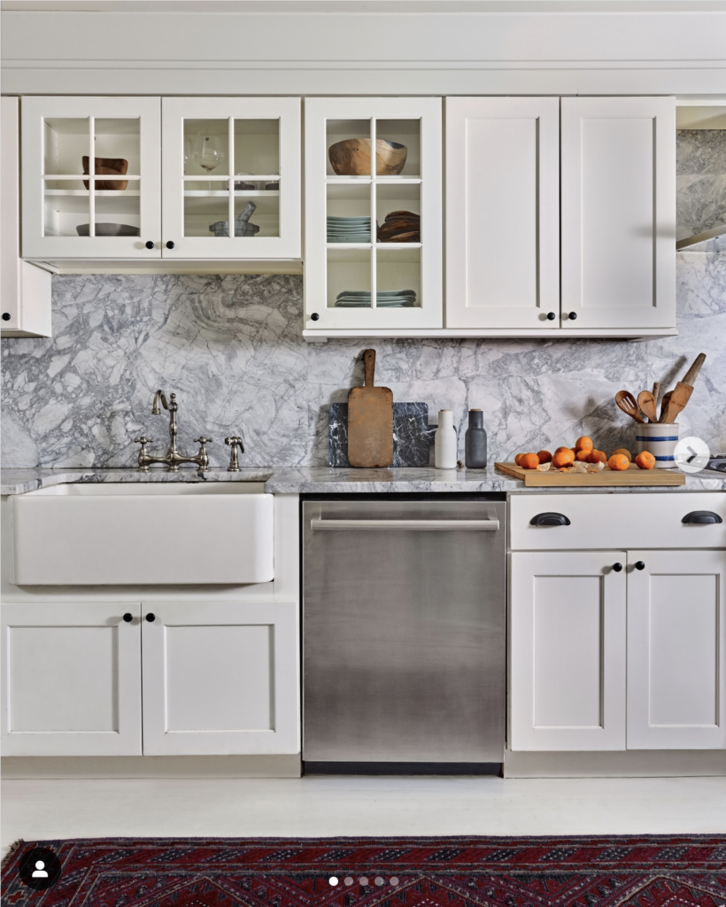 Glass Upper Cabinets with Gray Marble Backsplash