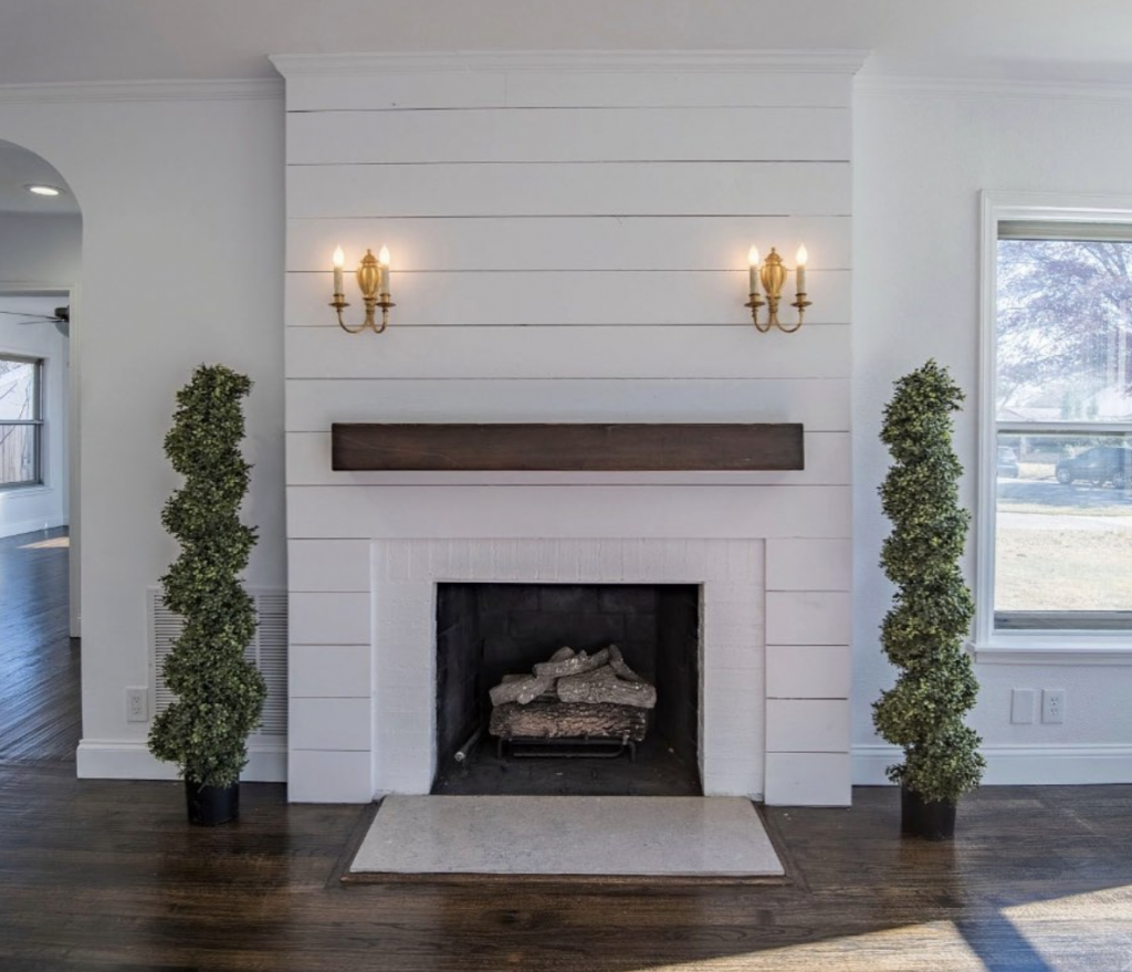 Gold Candle Sconces on a Shiplap Fireplace