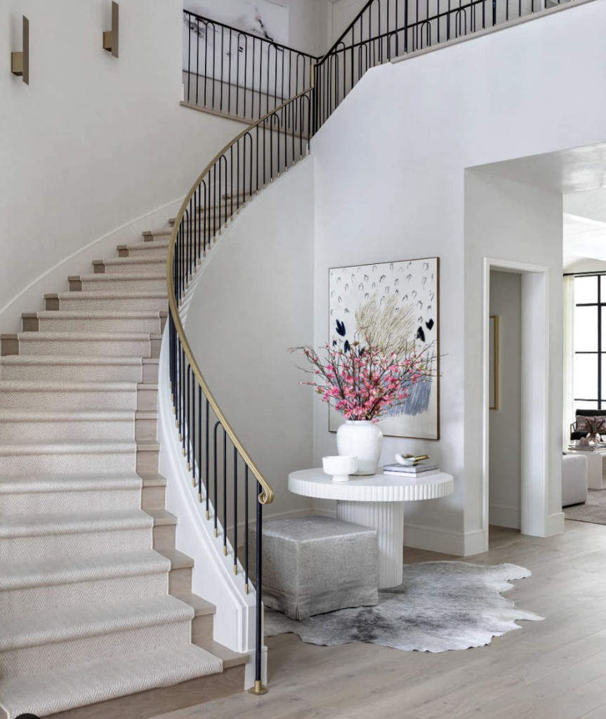 Gold Handrail on a Curved Staircase