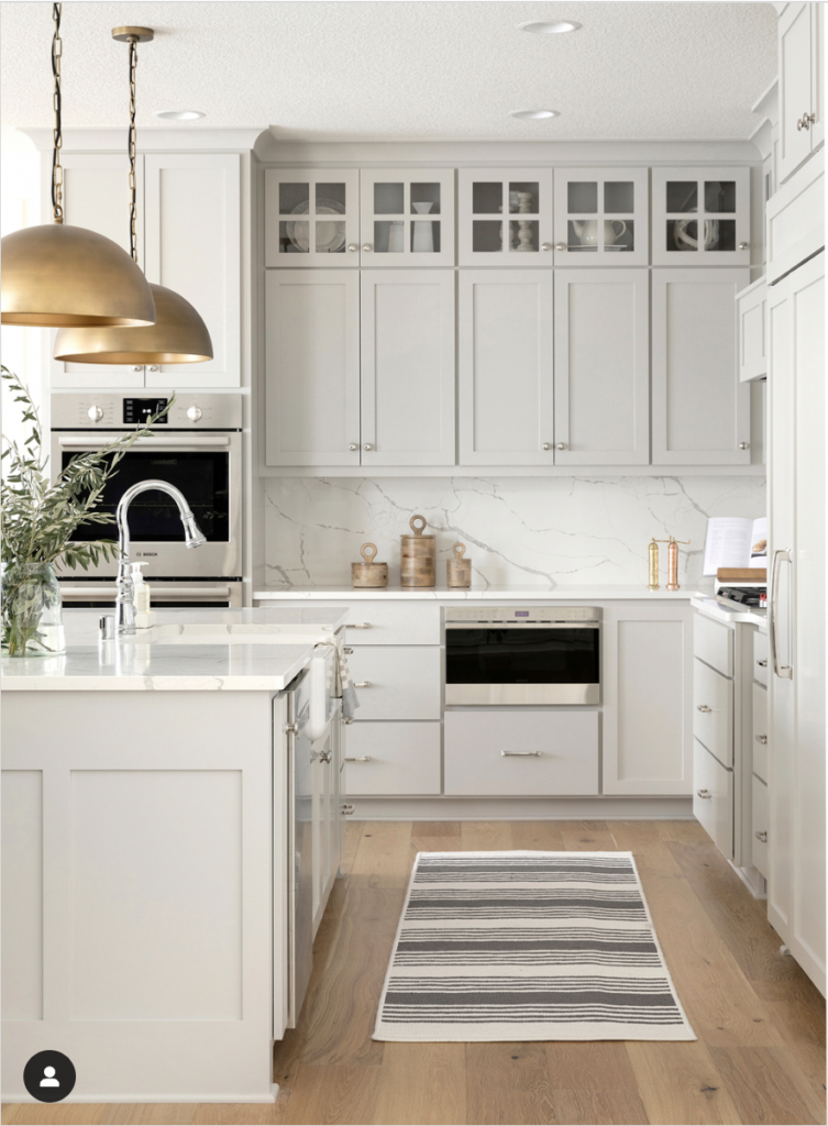 Gold Light Fixtures in a Kitchen with Gray Cabinets
